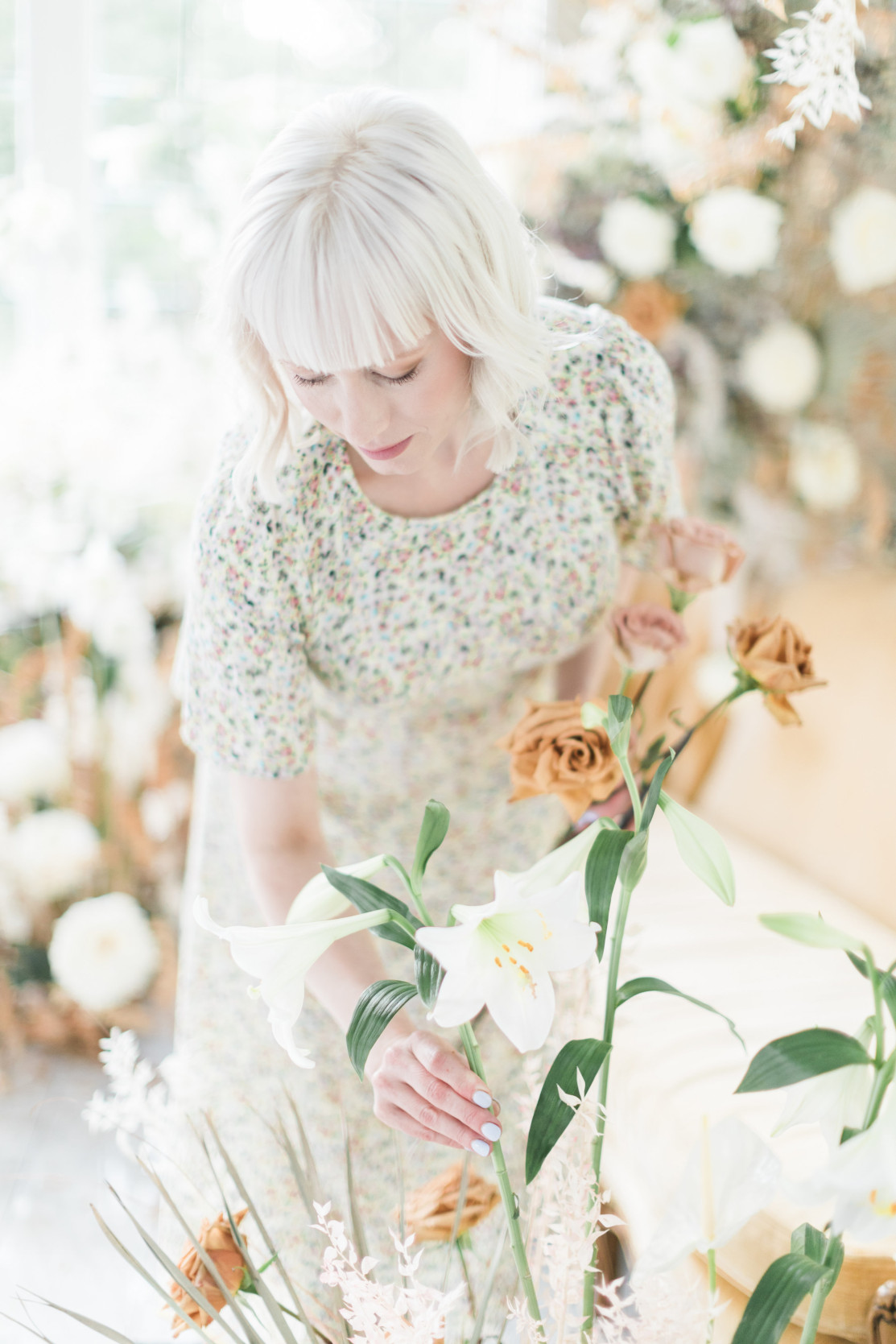 Autumn Keller who is the owner of Isibeal Studio arranges flowers.