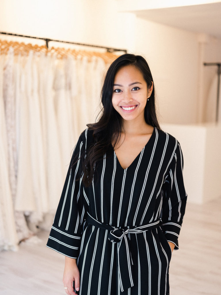 Headshot of Thuhien, the owner of Modern Romance, standing in her modern bridal boutique in Hilversum, the Netherlands. 