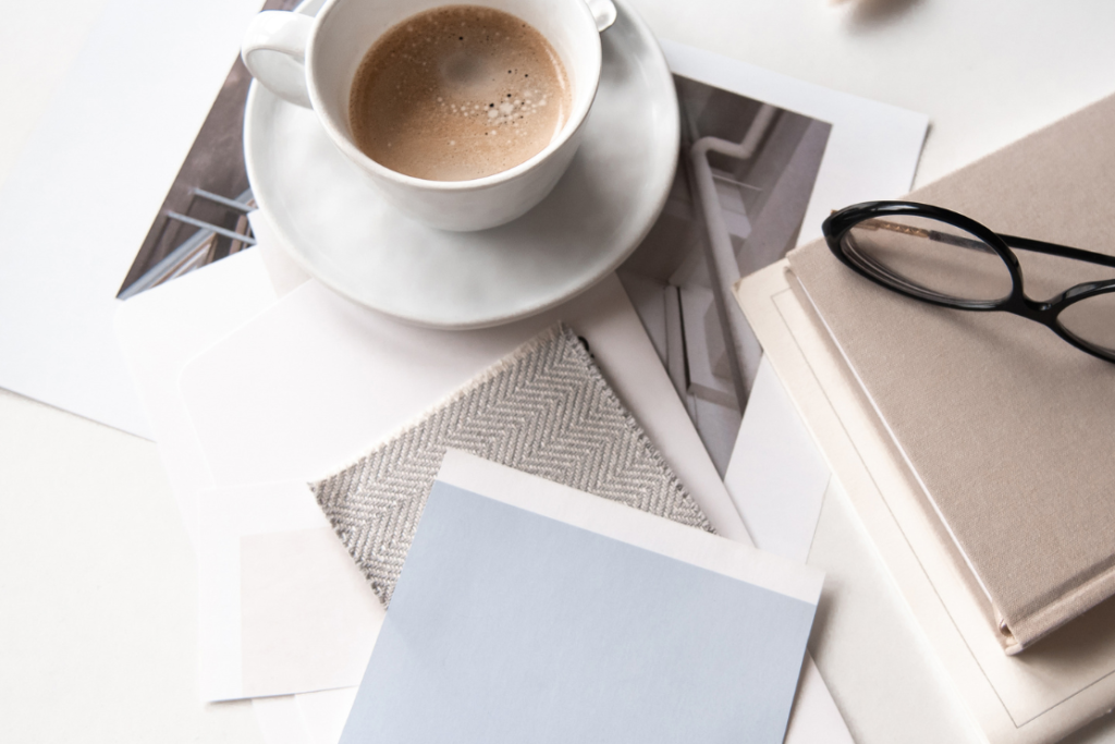 How to plan a destination wedding - Part 2: How to share your vision with your wedding vendors.

Stock photo of a desk cluttered with paint and fabric swatches, a cup of coffee, books, and glasses.